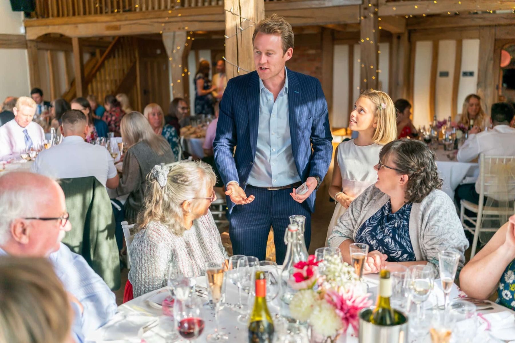 Richard Kettle performing close-up magic for wedding guests at Cain Manor