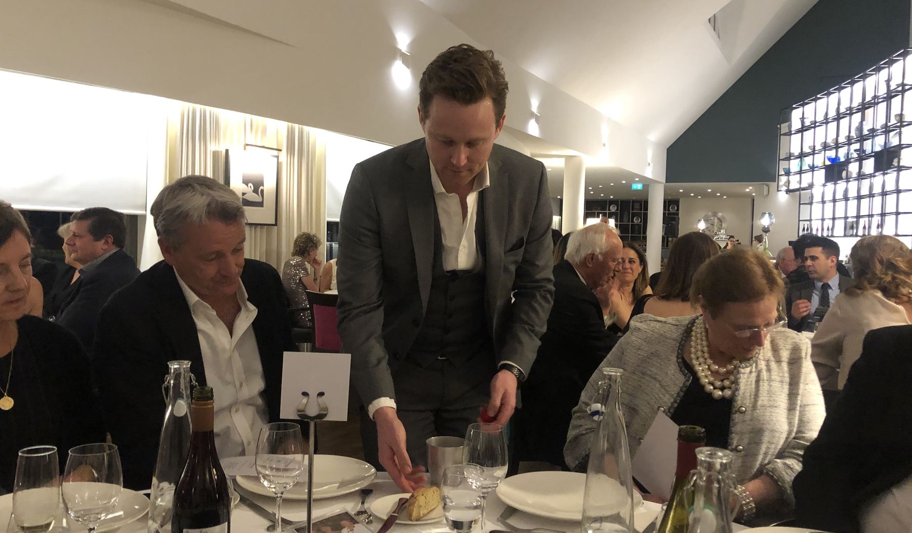 Richard Kettle performing close-up magic at a dinner at The Wisley near Woking