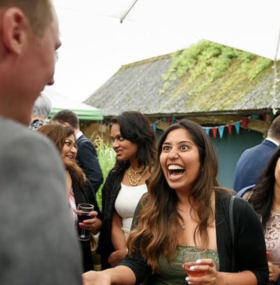 A guest reacting with delighted shock during close-up magic