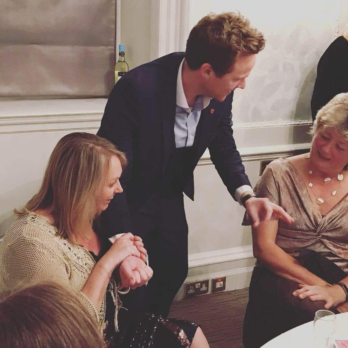 A guest watching closely during close-up magic